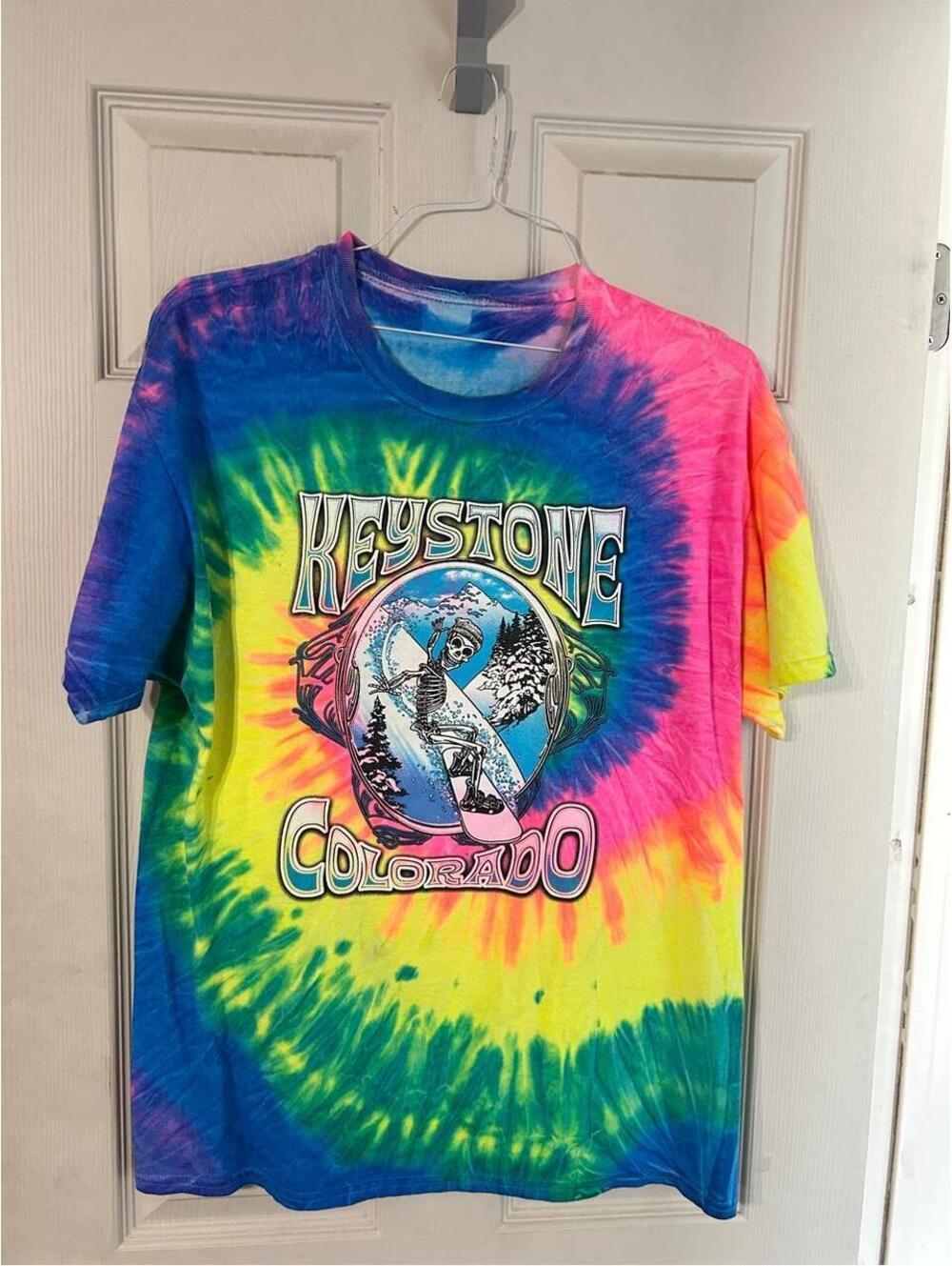 Keystone Colorado tie-dye t-shirt with graphic of a skeleton snowboarding